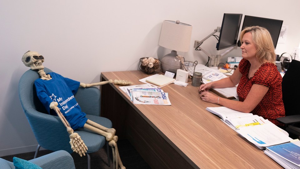 Dina Walker, Encompass Health national director of case management, said the skeleton in her office is her constant reminder that patients are always her first priority.