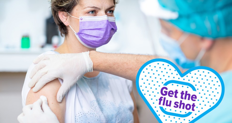 Woman receiving a flu shot - "get the flu shot"