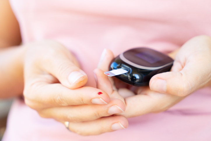 woman checking blood for prediabetes symptoms