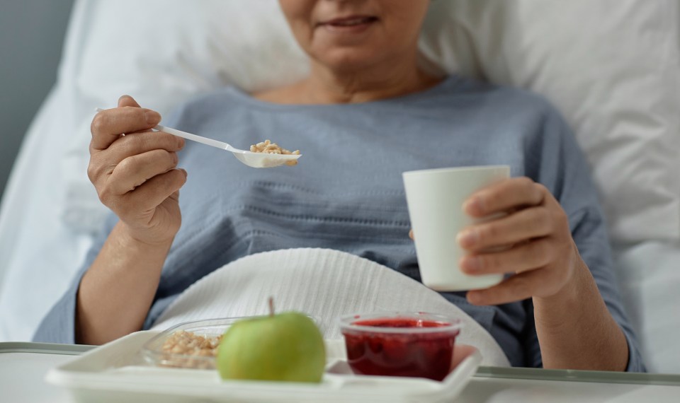 woman eating healing foods post surgery